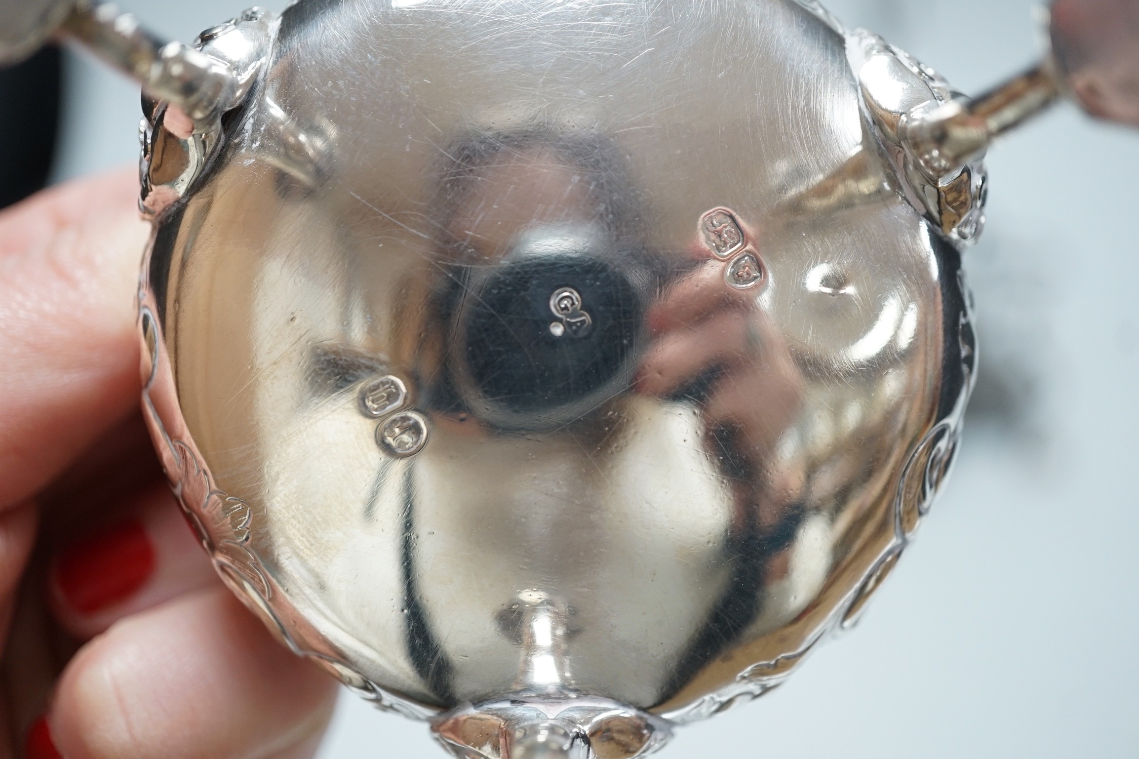 An early George III silver cruet stand, (lacking bottles and piece missing), John Delmester, London, 1763, height 23cm and a Victorian silver salt, 18.4oz.